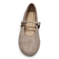 Light taupe Mary Jane flats with top strap, buckle detail, and rounded toe