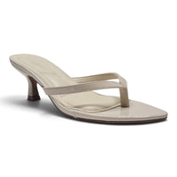 Ivory pointed-toe kitten heel slide sandals with slim toe strap and single ankle strap