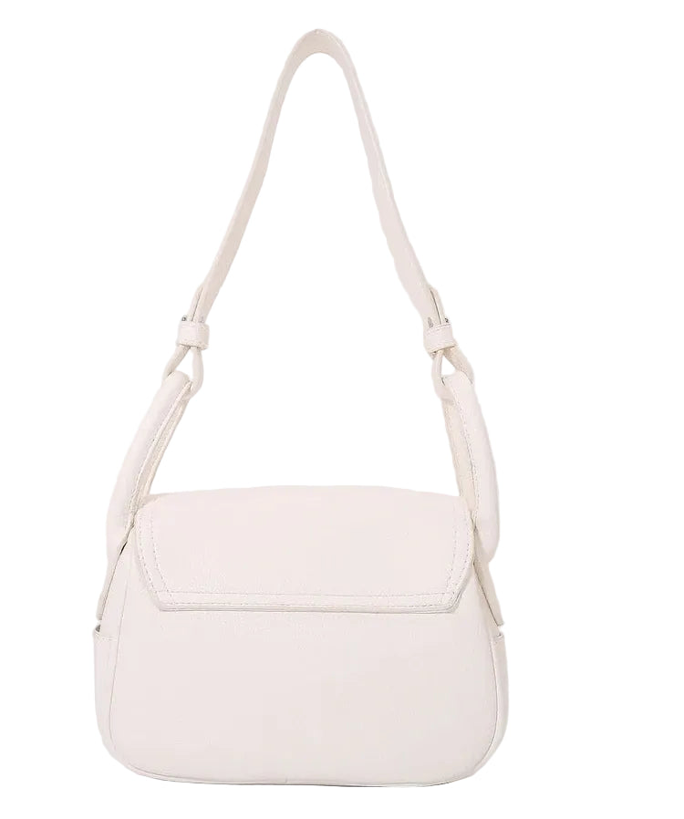 Light pink handbag with a strap on a light gray background
