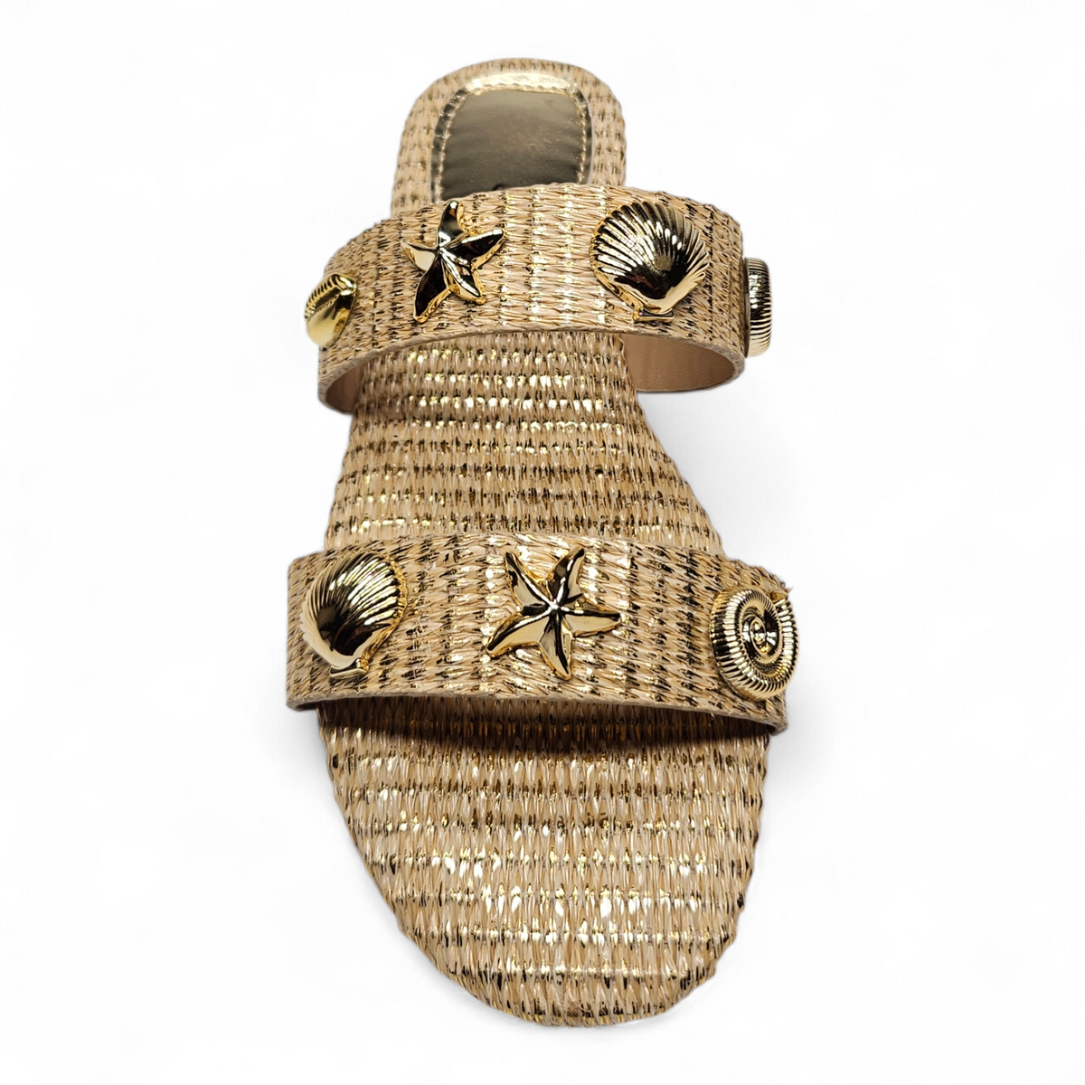 Gold sandal with shell and starfish designs on a white background