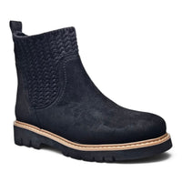 Black suede Chelsea bootie with textured side gore, tan welt, and treaded sole