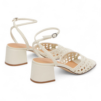 White crochet sandals with wooden soles on a white background