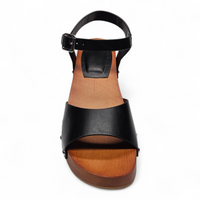 Black sandal with wooden sole on a white background