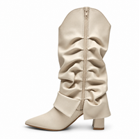 Ivory fold-over western boots with pointed toe, center zipper, and pleated shaft