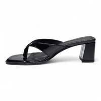 Black sandal with a block heel on a white background