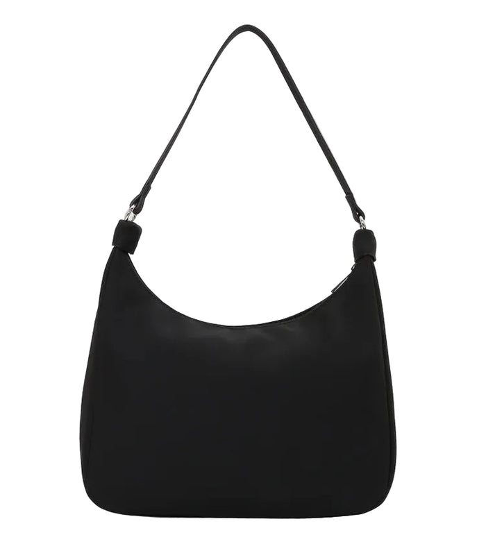 Black handbag on a light gray background