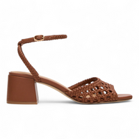 Brown woven sandal with a block heel on a white background