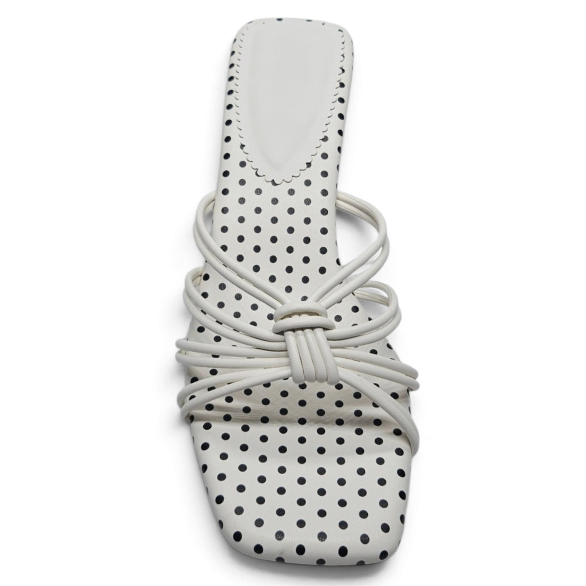 White polka dot kitten heel sandal with crisscross knot straps and rounded toe