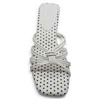 White polka dot kitten heel sandal with crisscross knot straps and rounded toe