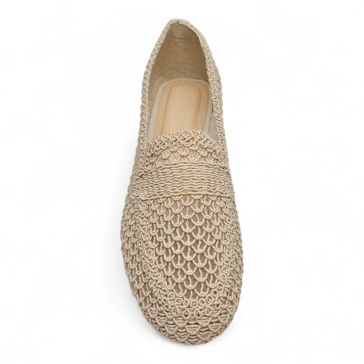 Beige woven flat shoe on a white background