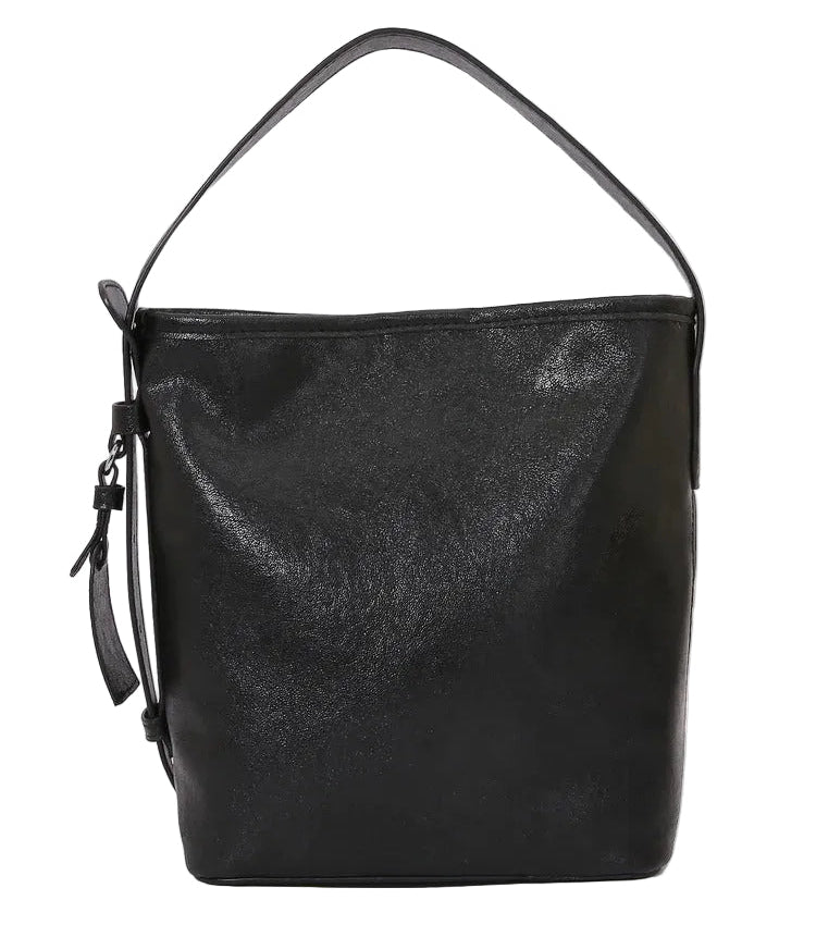 Black leather handbag on a light gray background