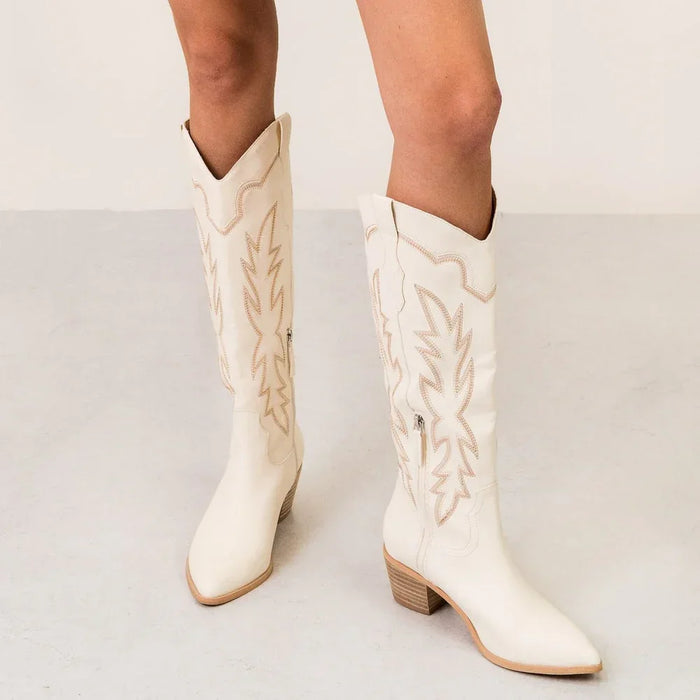 White leather Samantha Knee-High Western Boots with decorative stitching on the shaft