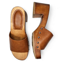 Pair of Wooden Open Toe Clogs featuring leather straps and metal studs