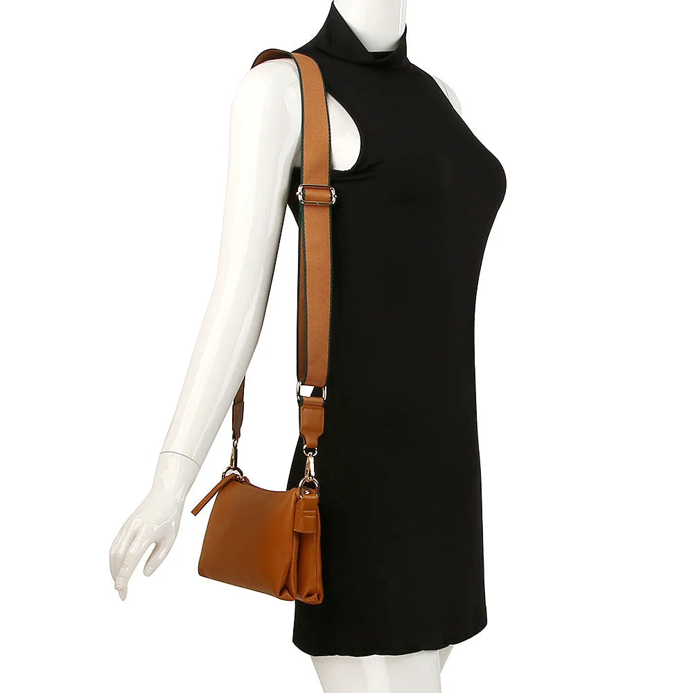 Black sleeveless turtleneck dress paired with a brown leather Sleek Petite Zipper Bag