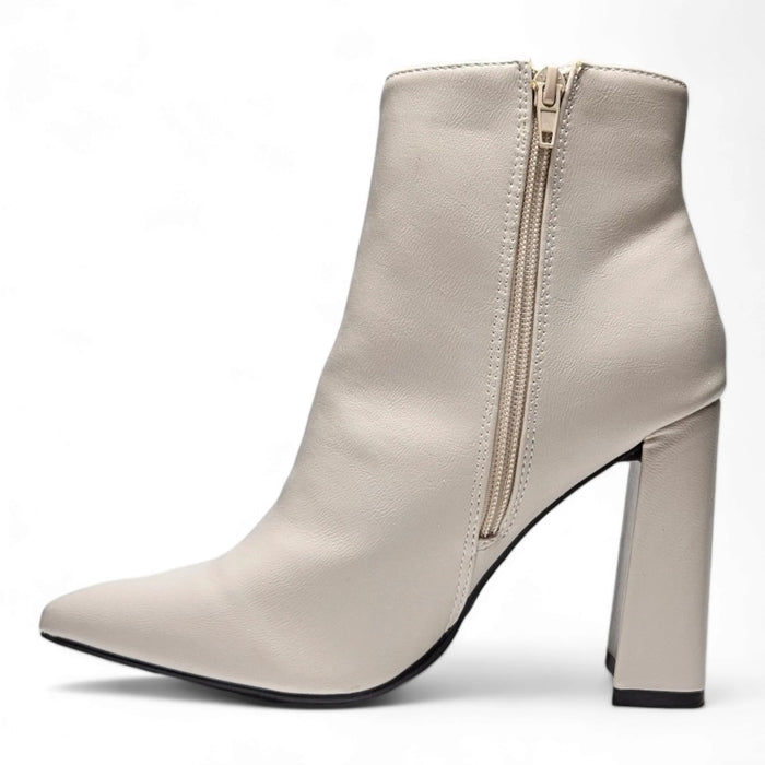 White leather slim pointed ankle bootie with a chunky high heel and pointed toe design