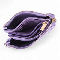 Purple leather wallet with multiple compartments and gold zipper in a small woven crossbody