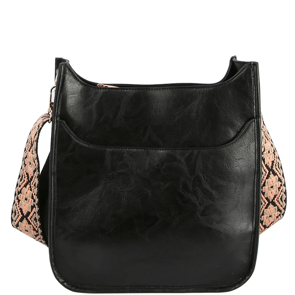 Black leather crossbody bag featuring a stylish snakeskin-patterned guitar strap