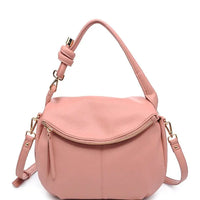 Pink leather messenger bag with curved top flap and adjustable shoulder strap