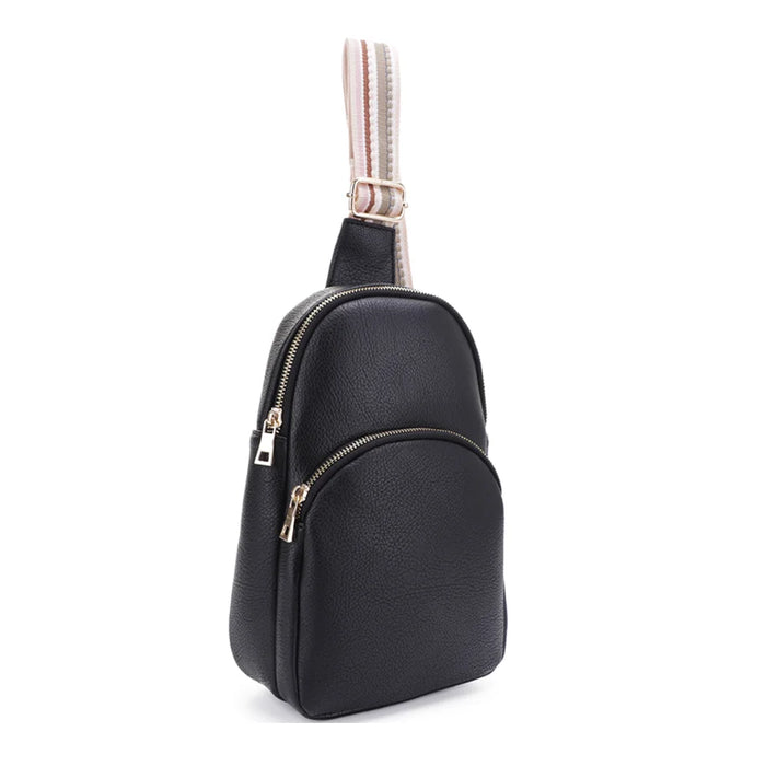 Black leather sling bag with smooth strap pattern and zippered compartments