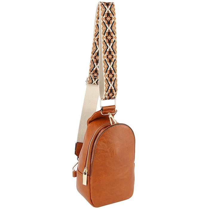 Brown leather smooth zipper sling crossbody bag with decorative patterned strap