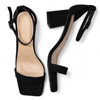 Black high-heeled sandals with ankle straps, featuring a stylish square toe heel design