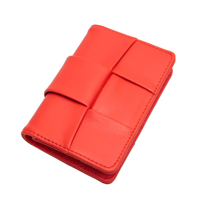 Red leather square woven wallet with folding design and strap closure