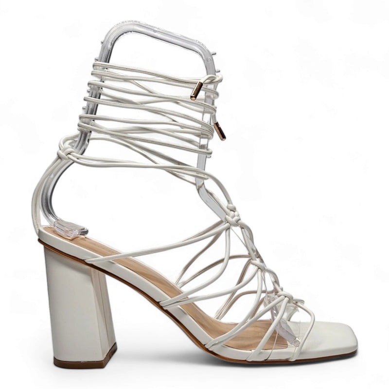 White strappy lace up heel featuring ankle ties and a stylish chunky heel