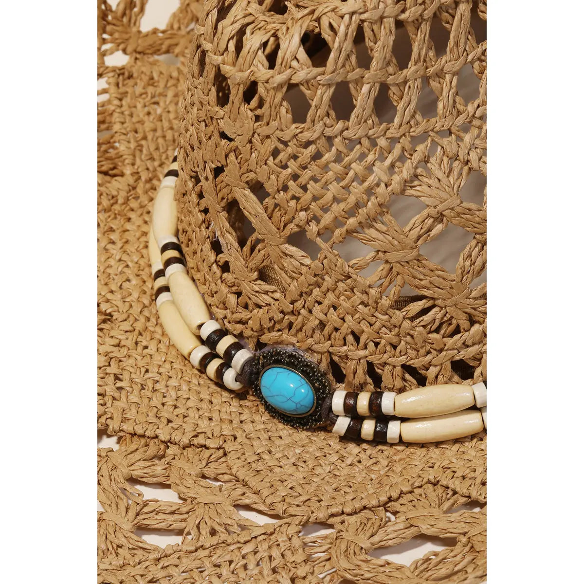 Native American-style choker necklace with bone beads and turquoise on straw braided cowboy hat