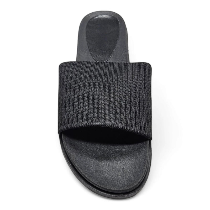 Black slide sandal featuring a stretch woven upper strap for comfort and style