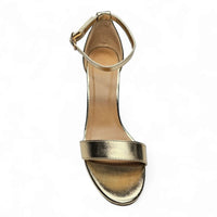 Gold metallic high-heeled sandal with ankle strap, perfect for classic chunky style