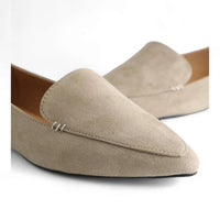 Beige suede ballet flat featuring a stylish pointed toe design