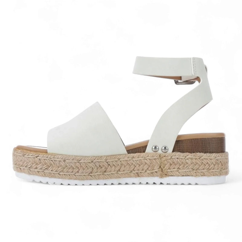 White platform sandal with ankle strap and espadrille-style sole from Summer Platform Wedges