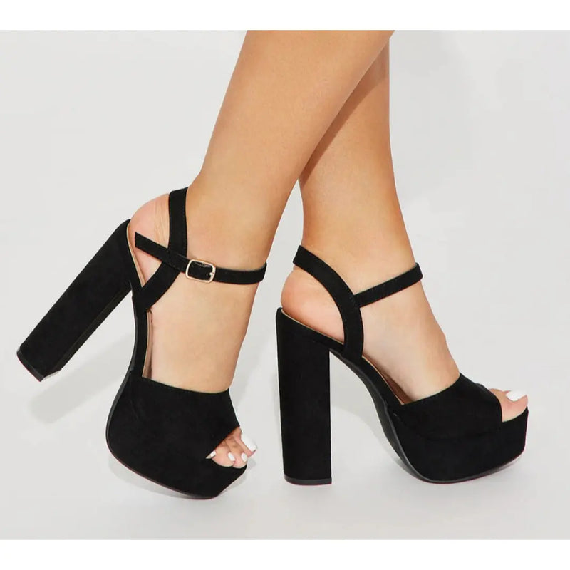 Black suede platform sandals with chunky high heels, perfect Vegas pumps for any occasion