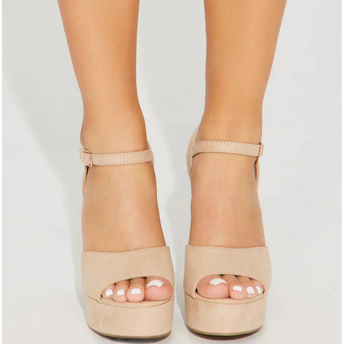 Nude-colored platform sandals with ankle straps from When in Vegas Pumps collection