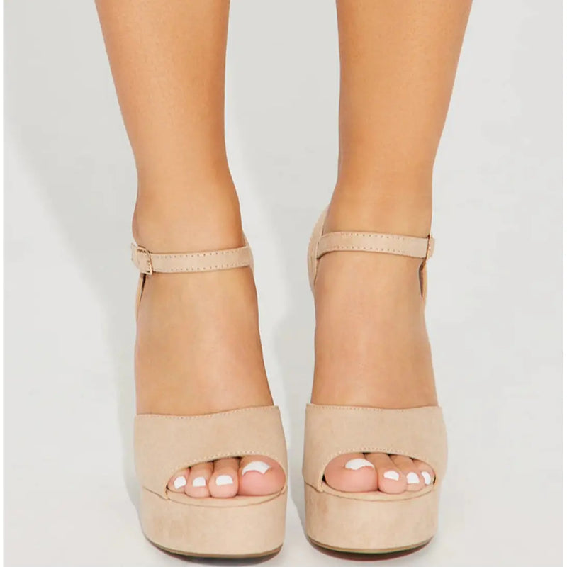 Nude-colored platform sandals with ankle straps from When in Vegas Pumps collection