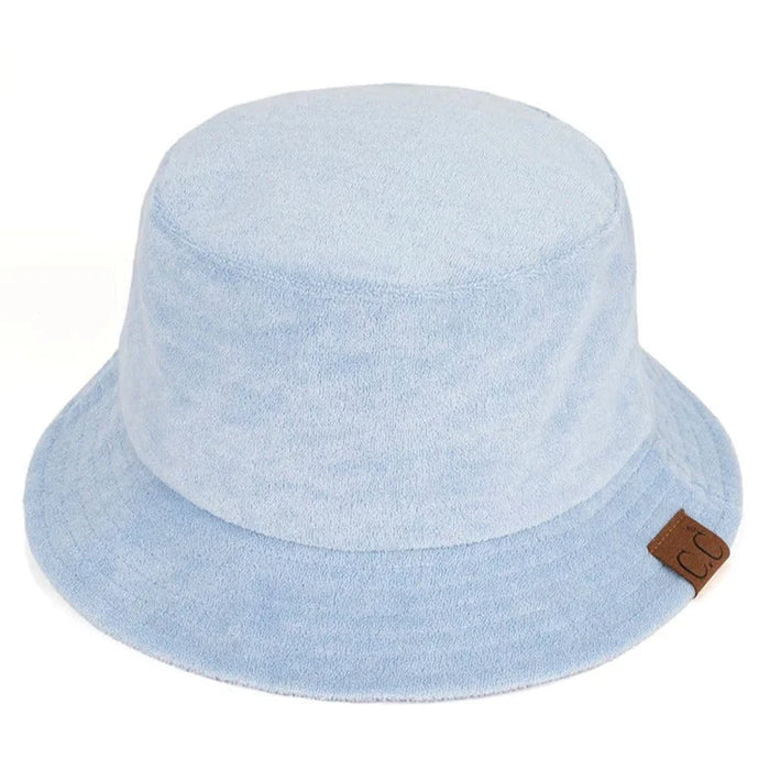 Light blue terry cloth bucket hat with brown leather tag for stylish comfort