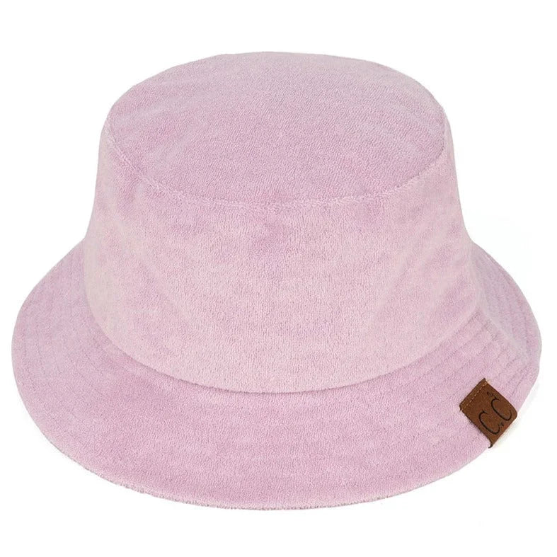 Pastel pink Terry Cloth Bucket Hat with a small brown leather tag