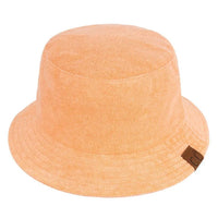 Peach terry cloth bucket hat featuring a small brown label for stylish summer wear