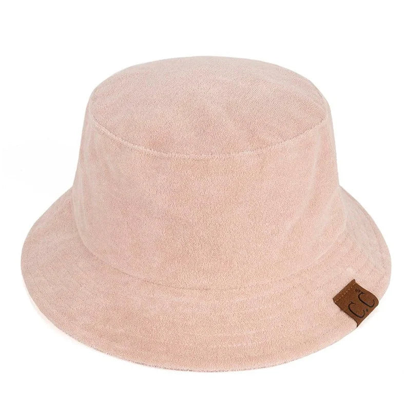 Pale pink Terry Cloth Bucket Hat with a small brown leather tag for stylish comfort