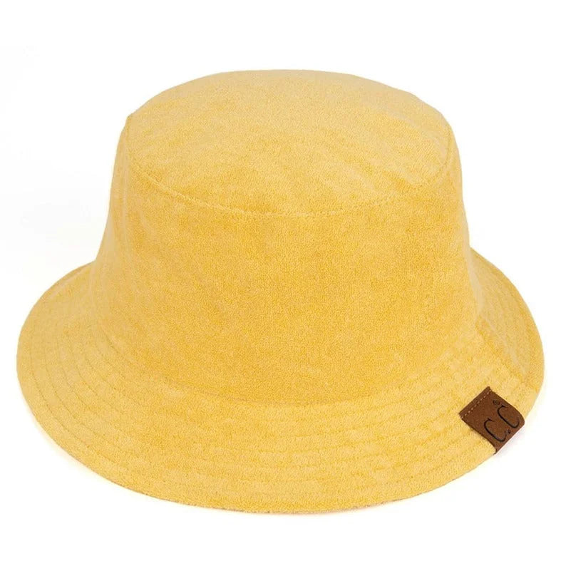 Yellow Terry Cloth Bucket Hat featuring a small brown leather tag