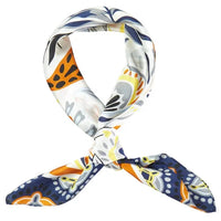 Colorful patterned silk Tropical Leaves Scarf tied in a stylish knot