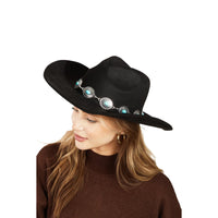 Black wide-brimmed cowboy hat with turquoise oval stone strap and silver concho belt