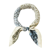 Silk Two Tone Leopard Scarf tied in a loop showcasing a stylish leopard print pattern