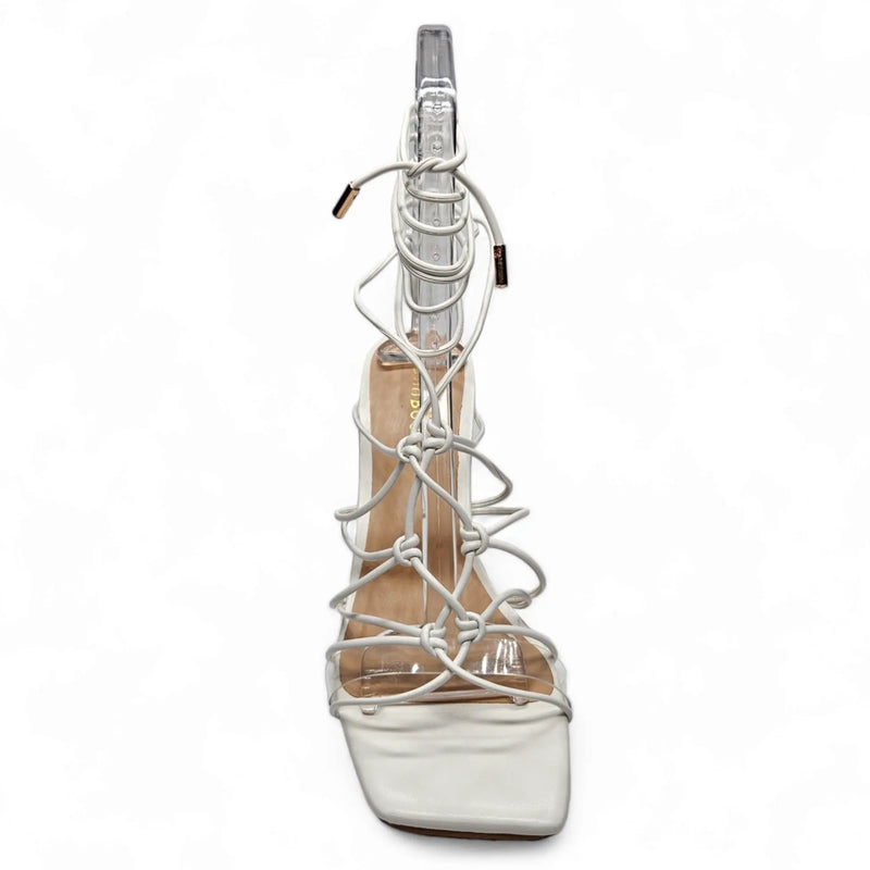 Strappy lace up heel featuring a silver high-heeled sandal with ankle lacing