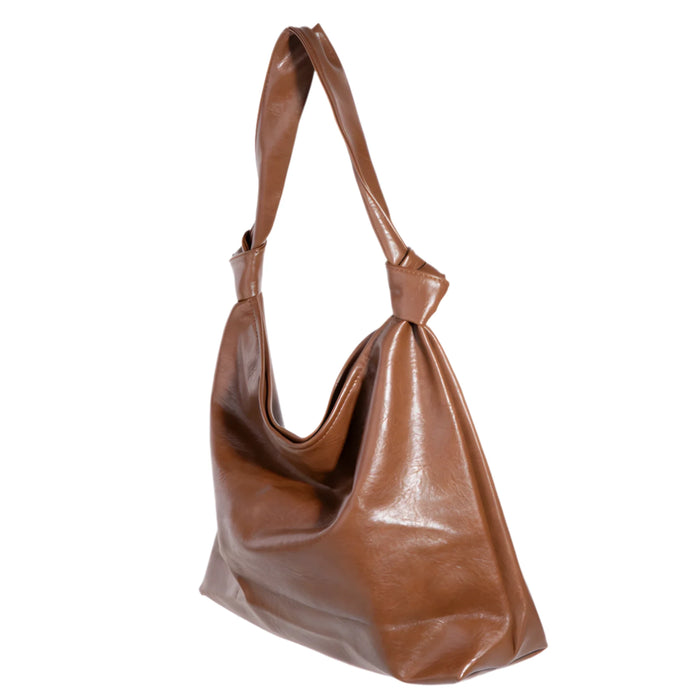 Brown leather hobo bag with knotted strap showcasing a weathered faux leather tote bag