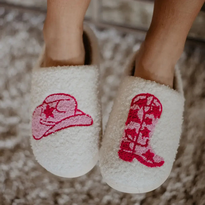 White slippers featuring red cowboy hat and boot designs, perfect for Western enthusiasts