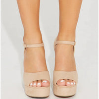 Nude-colored platform sandals with ankle straps from When in Vegas Pumps collection