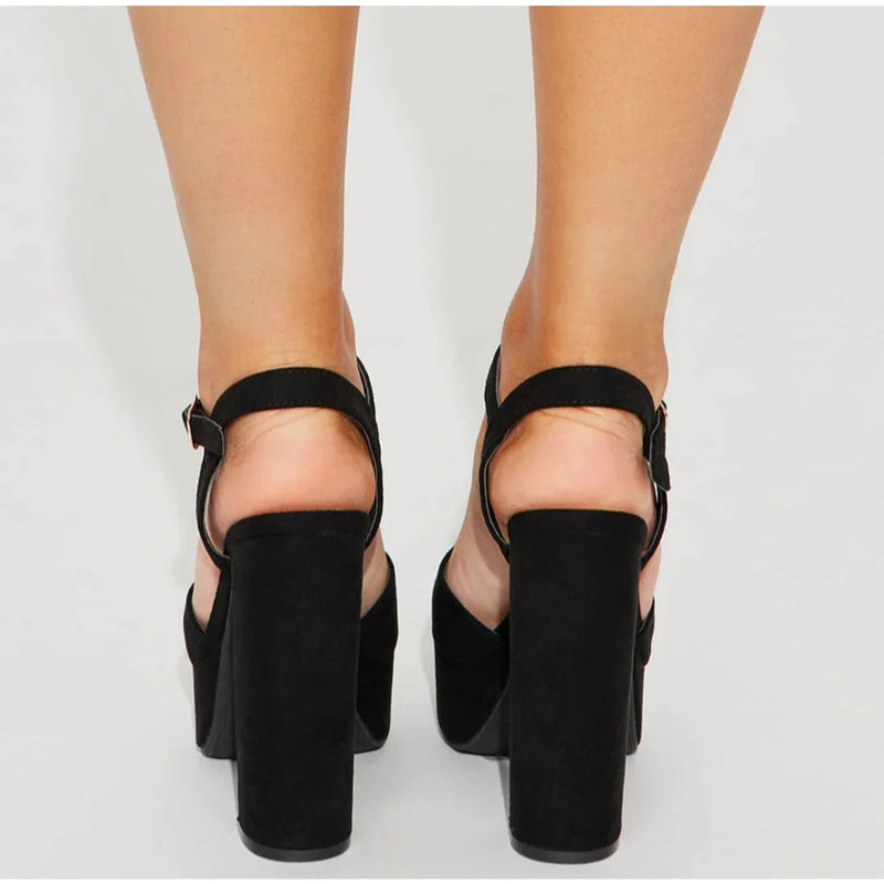 Black platform sandals with chunky heels and ankle straps perfect for Vegas pumps styling