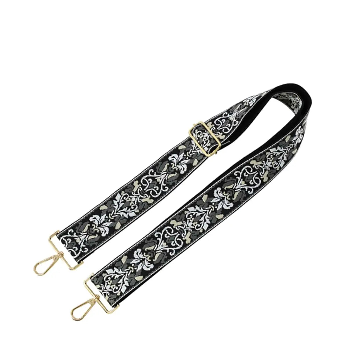 Decorative black and white floral tribal pattern guitar strap with gold-toned hardware