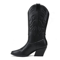 Black leather cowboy boot with decorative stitching, Wild West style pointed toe